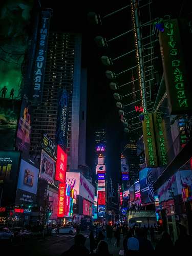 urban group of people walking on New York Timesquare during nighttime city